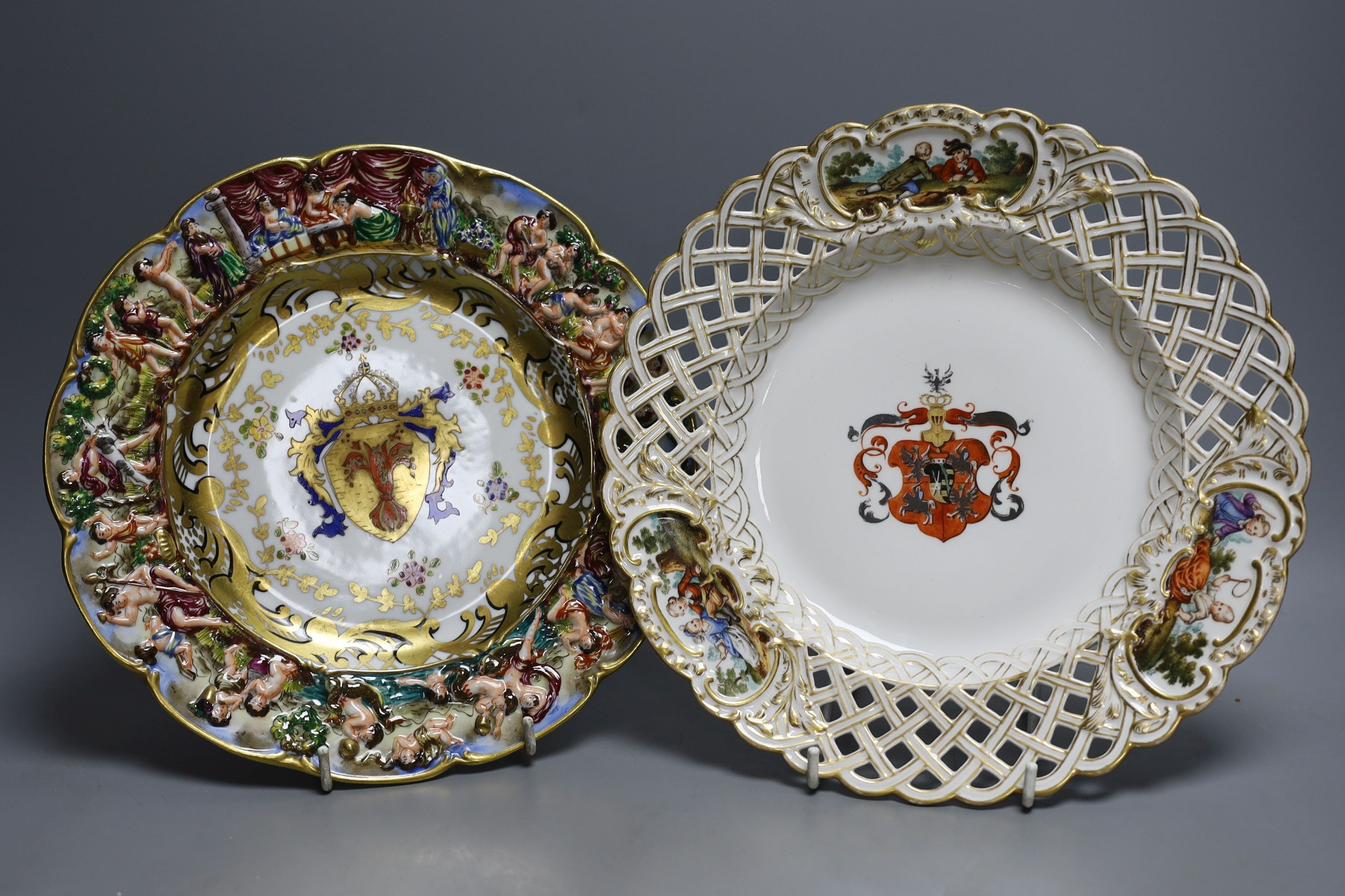 A Dresden armorial ribbon plate, two Sevres style plates and a Capodimonte style plate, late 19th/early 20th century (4)